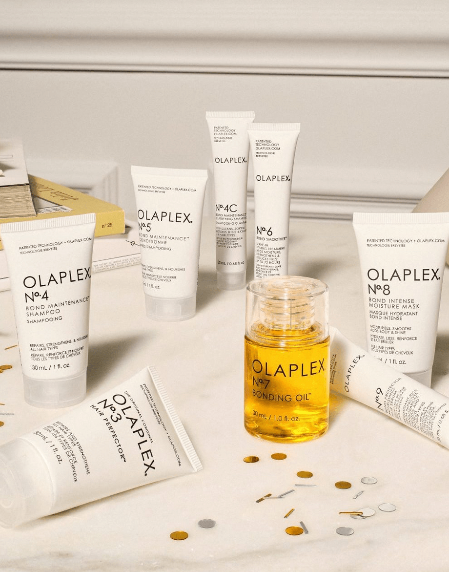 Olaplex assortiment feestelijk opgesteld met gouden confetti